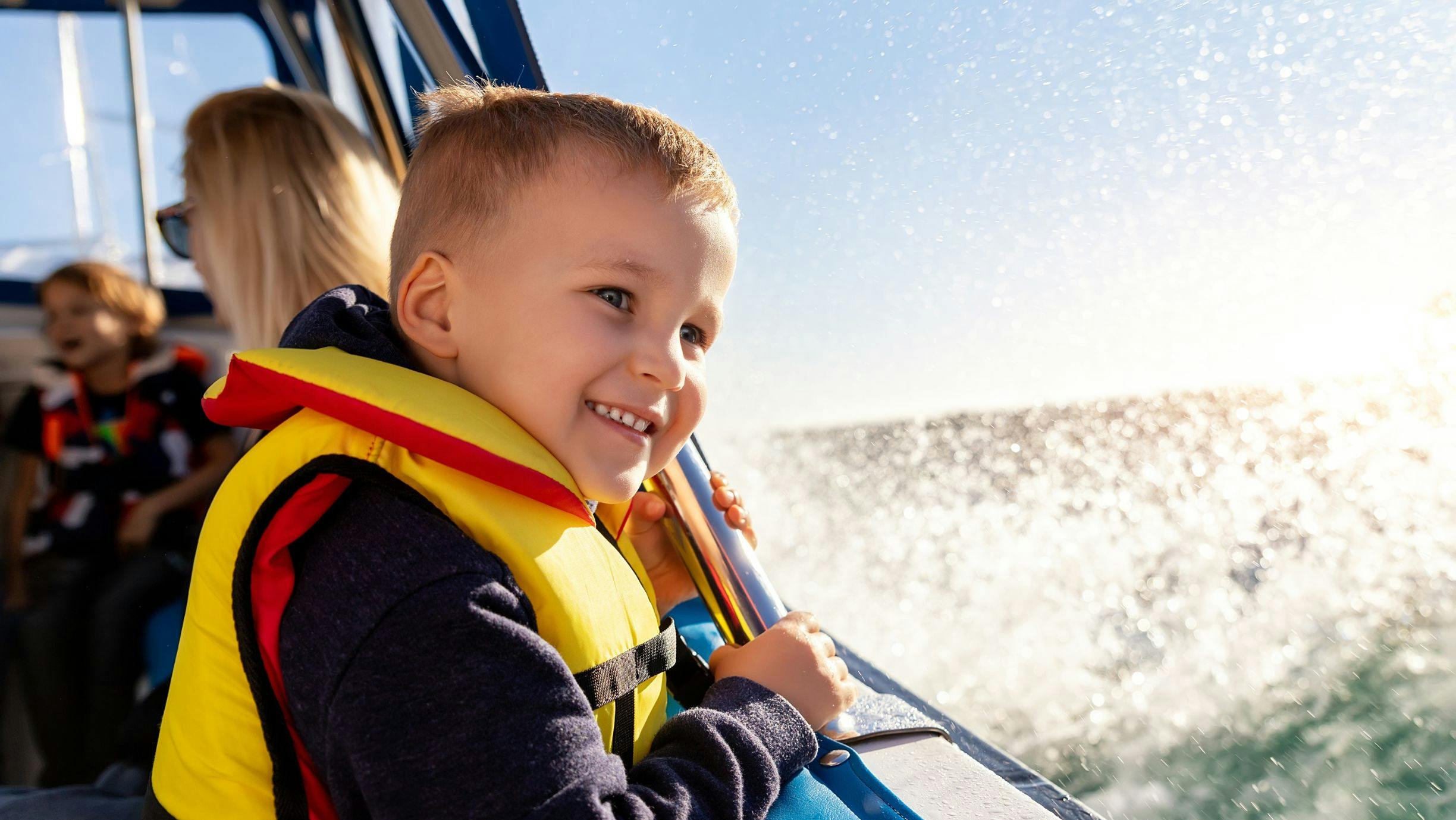A child on a ship enjoying a canal tour